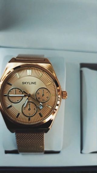 Reloj Skyline dorado con 2 brazaletes