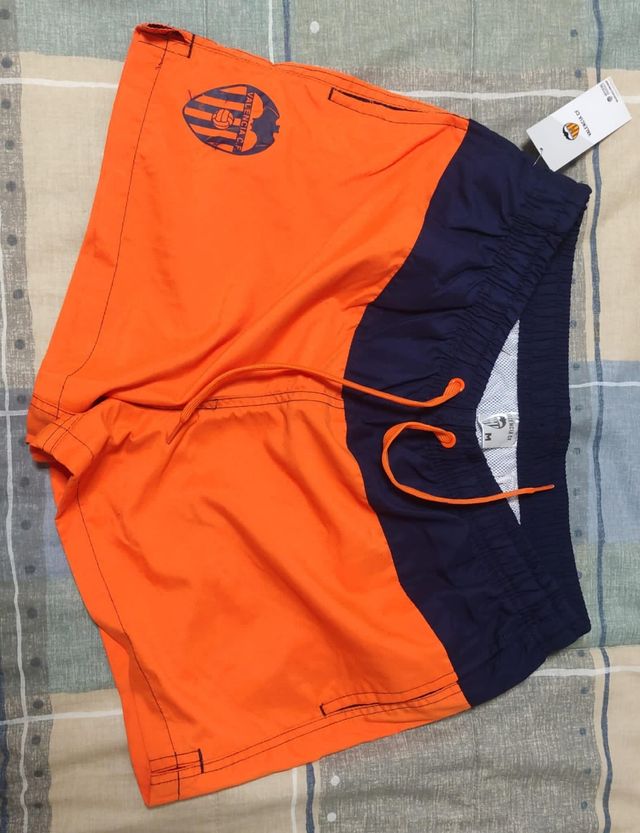Bañador infantil del Valencia. Naranja/azul marino