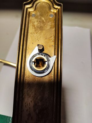 Manetas latón puerta