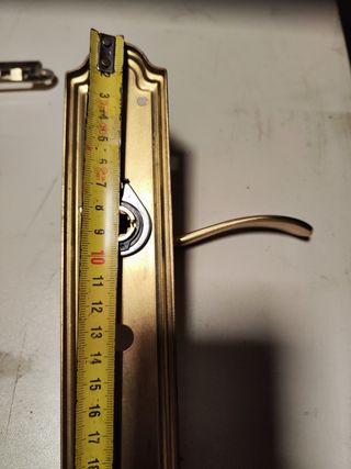 Manetas latón puerta