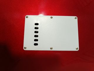 Guitarra eléctrica roja y blanca-
Nueva