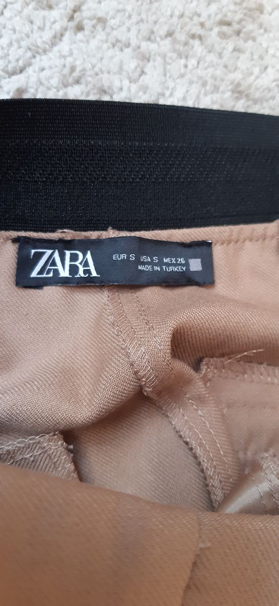 2 pantalones: beige negro