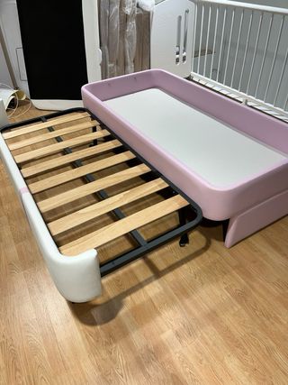 Cama nido rosa y blanca
