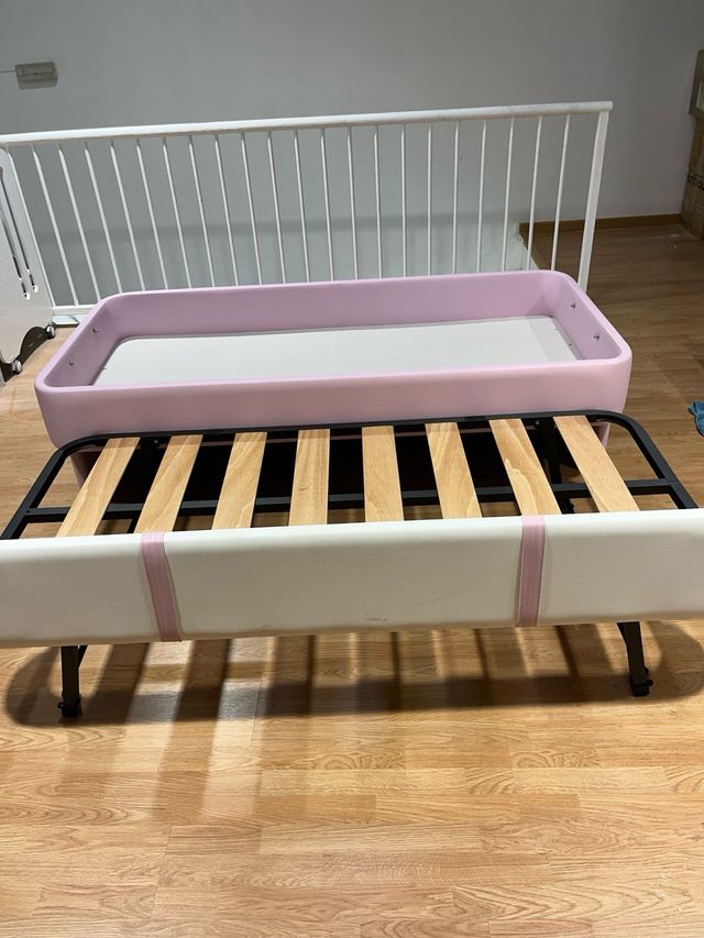 Cama nido rosa y blanca