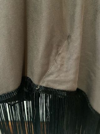 Poncho con flecos y abalorios