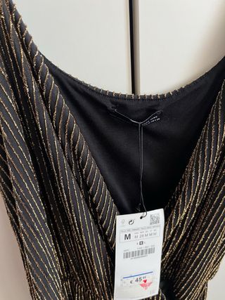 Mono negro y dorado Zara