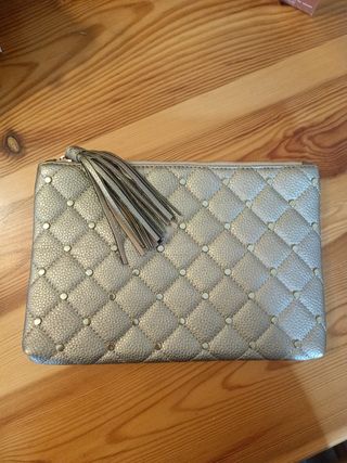 Bolso de mano dorado . Nuevo.