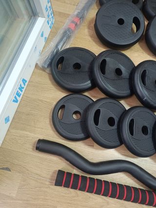 Pareja de mancuernas con accesorios.