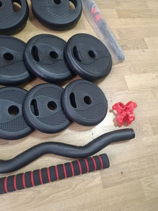 Pareja de mancuernas con accesorios.