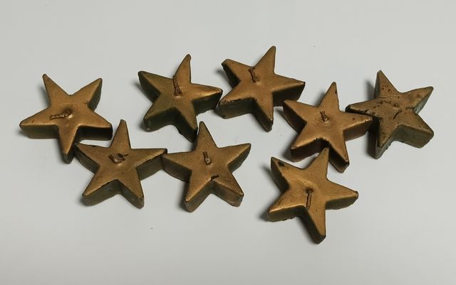 Candele galleggianti a forma di stella dorata - 8 pezzi