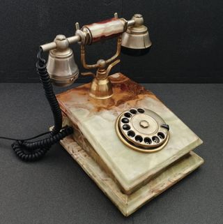 Teléfono de ónix y oro 18k