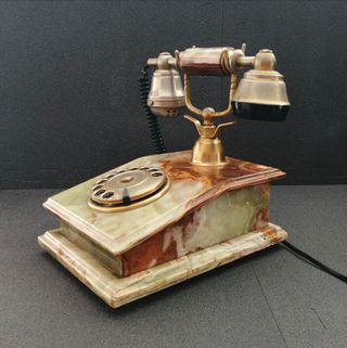 Teléfono de ónix y oro 18k