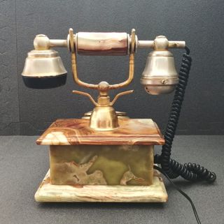 Teléfono de ónix y oro 18k