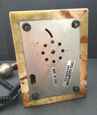 Teléfono de ónix y oro 18k