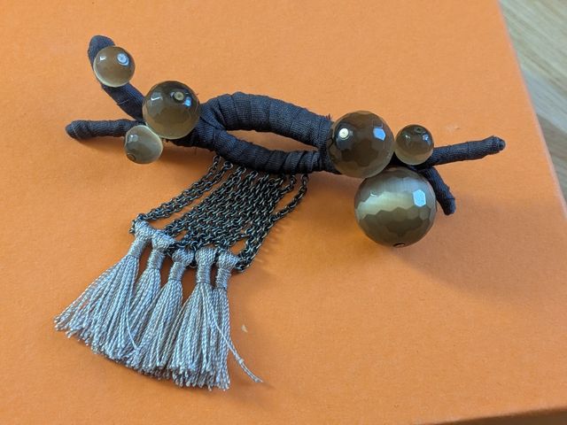 Broche Hoss Intropia marrón y gris, ojo de tigre