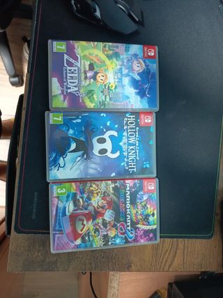 Nintendo Switch OLED + 3 juegos y dos fundas 