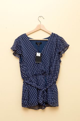 Blusa con escote cruzado tipo peplum de Cortefiel