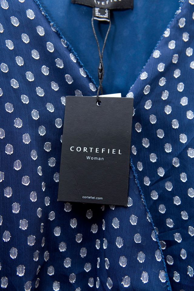 Blusa con escote cruzado tipo peplum de Cortefiel