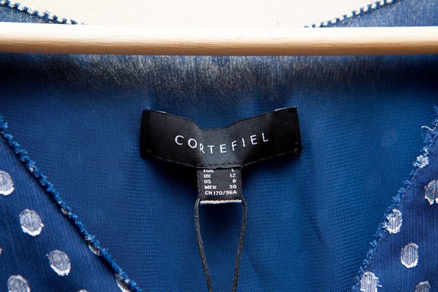 Blusa con escote cruzado tipo peplum de Cortefiel