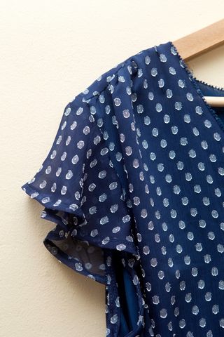 Blusa con escote cruzado tipo peplum de Cortefiel