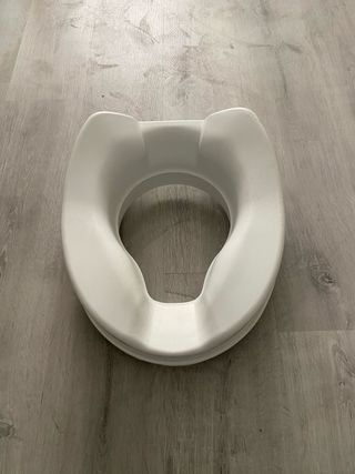 Asiento elevador WC