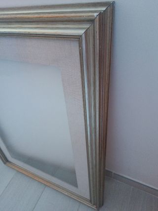 Cornice in legno dorato argentato