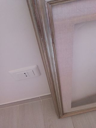 Cornice in legno dorato argentato