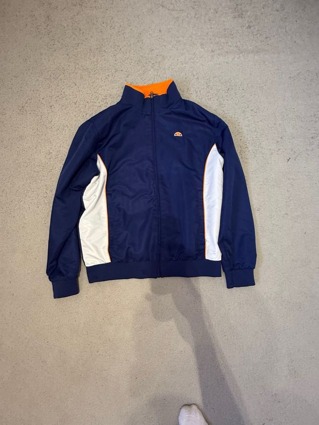 Chaqueta ellesse azul y naranja