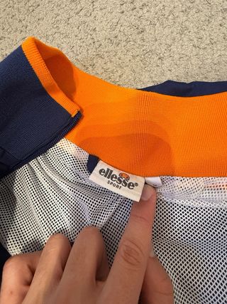 Chaqueta ellesse azul y naranja