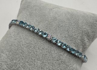 Pulsera riviere de oro 18 kt topacios y diamantes