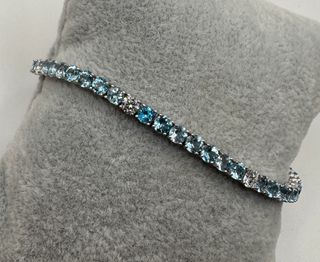 Pulsera riviere de oro 18 kt topacios y diamantes