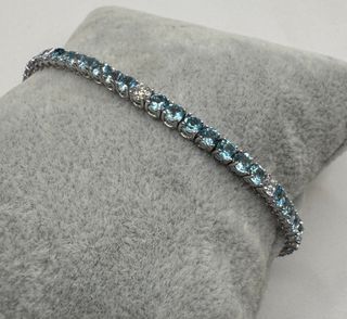 Pulsera riviere de oro 18 kt topacios y diamantes