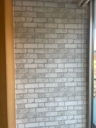 Papel pintado ladrillo gris