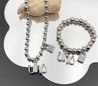 Pulsera y collar Uno de 50 plata