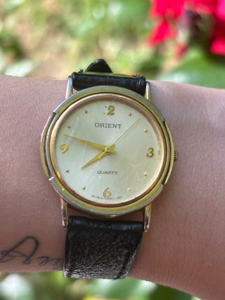 Reloj Orient cuarzo dorado