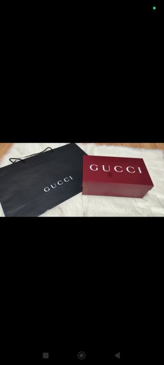 Caja y bolsa Gucci