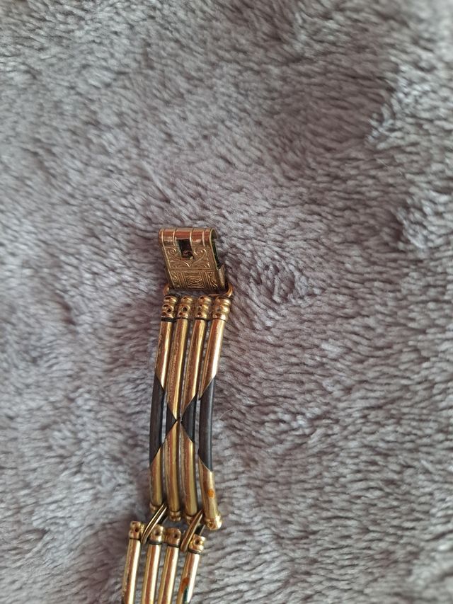 Pulsera de los 70s, color oro y negro