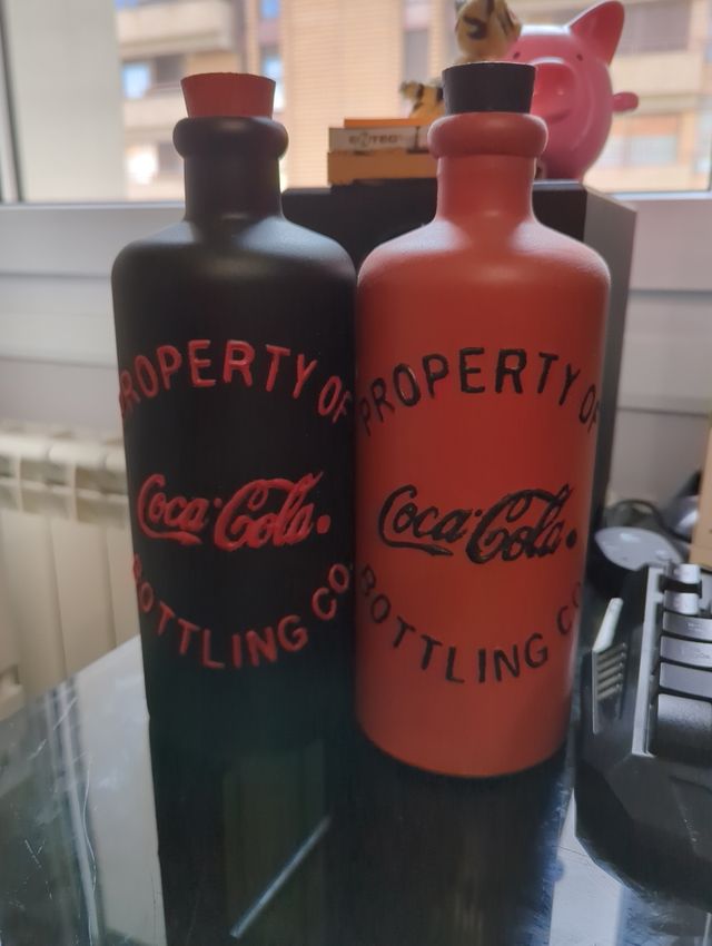Bottiglie vintage Cocacola e bicchiere