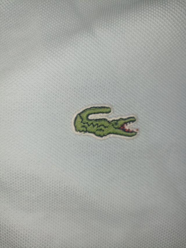 Polo Lacoste turquesa talla L 