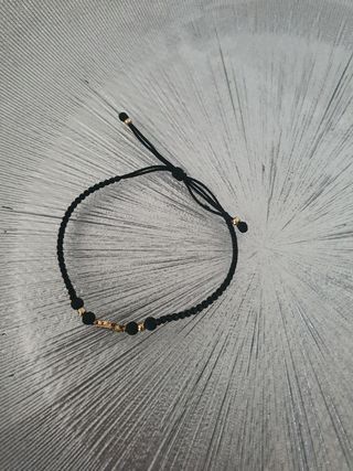 Pulsera negra con trébol verde oro 18 k colombiano