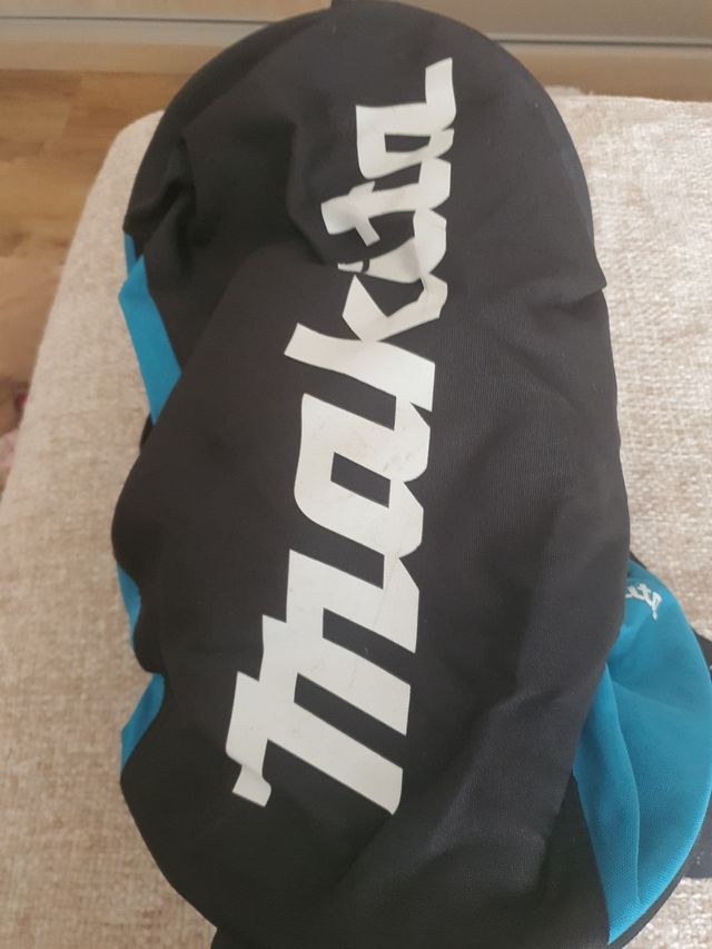 Bolsa Thrasher negra y verde azulado