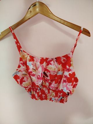 Dos conjuntos top y pantalón rojo y rosa