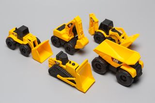 Lote 5 Grúas Caterpillar de plástico