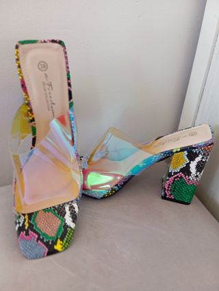 Brand new in box. Coloured heels and clear shoe