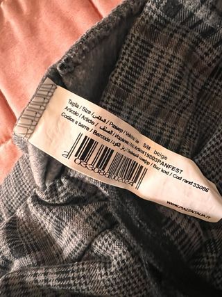 Pantaloni a quadri grigi e marroni