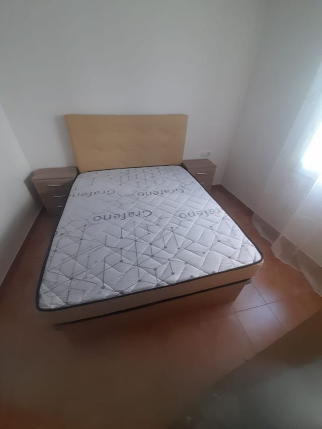 Canapé cama con cabecero tapizado