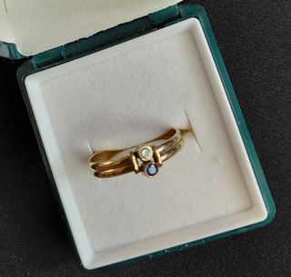 Anillo oro laminado 14kl circonita y piedra azul
