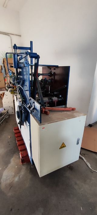 Maquina fabricación de perchas tintorerias textil.