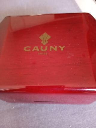 Reloj Cauny plateado y dorado, muy bueno
