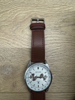 Mochila marrón + reloj